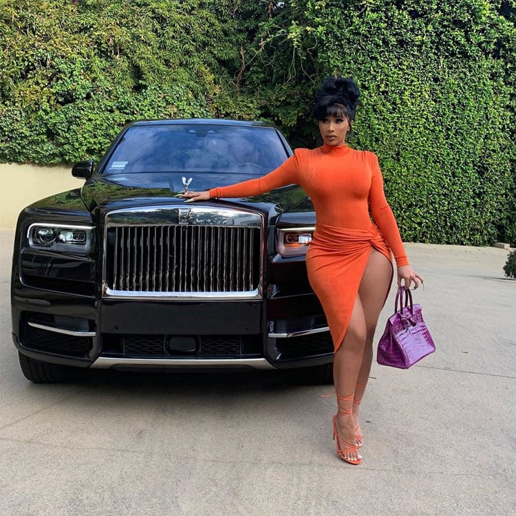 Cardi B Dons Orange JLuxLabel While Posing Alongside Her Rolls-Royce Truck