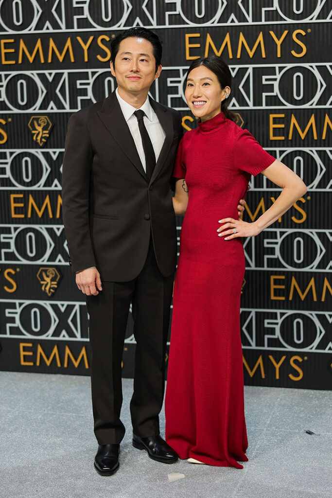 Steven Yeun and Jo Pak in Louis Vuitton - 75th Primetime Emmy Awards