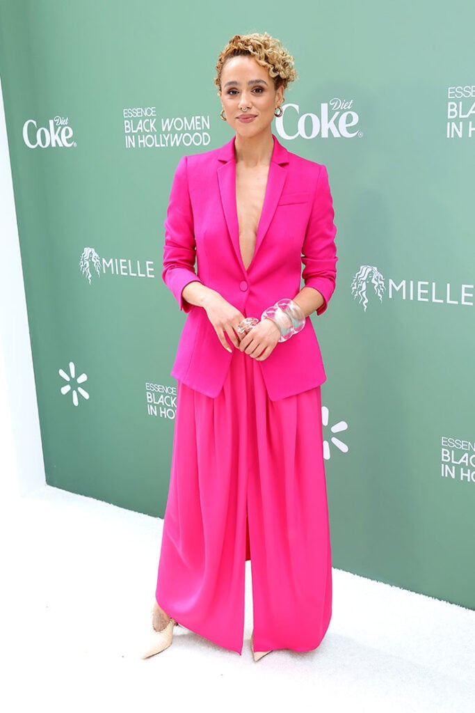 Nathalie Emmanuel attends the 2025 ESSENCE Black Women In Hollywood Awards
Nathalie Emmanuel in a Hot Pink Suit