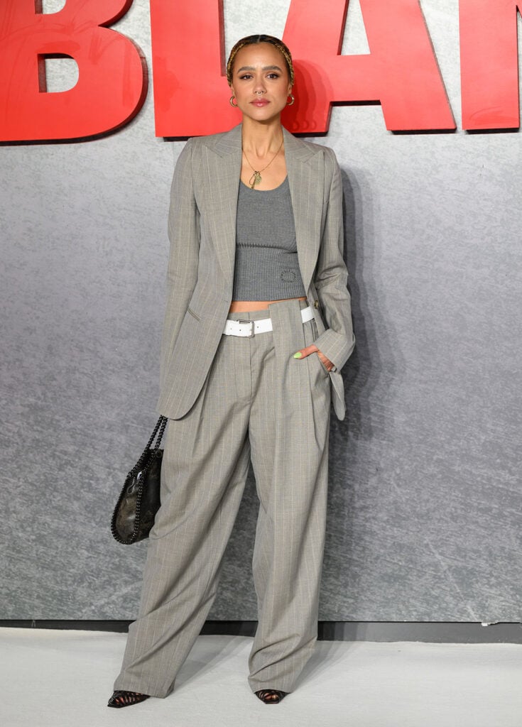 Nathalie Emmanuel Stella McCartney Spring 2025 striped suit 'Mobland' London Premiere