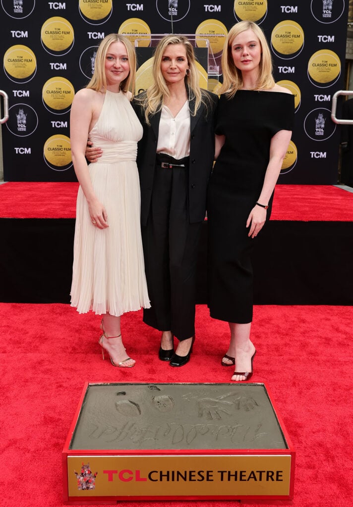 Dakota Fanning, Michelle Pfeiffer and Elle Fanning are seen as TCM honors actress Michelle Pfeiffer with Hand and Footprint Ceremony