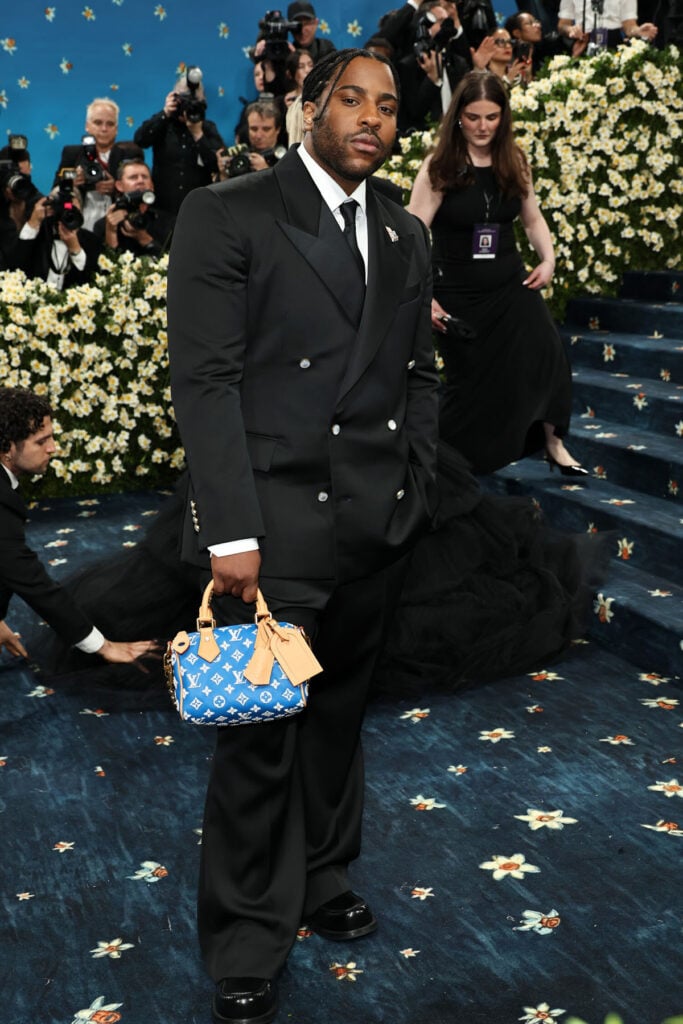 Malcolm Washington attends the 2025 Met Gala Celebrating "Superfine: Tailoring Black Style" in Louis Vuitton
