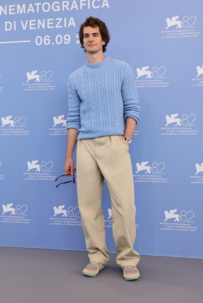 Andrew Garfield attends the "After The Hunt" photocall Venice International Film Festival dressed in blue cable-knit Dior Men