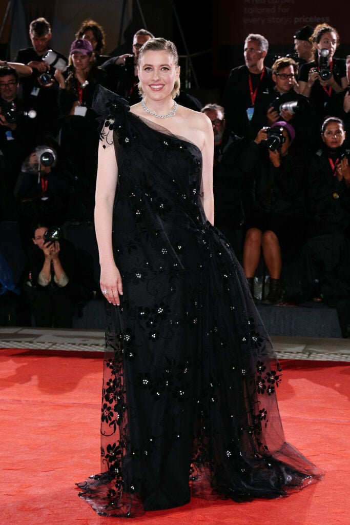 Greta Gerwig Wore Rodarte To The ‘Jay Kelly’ Venice Film Festival Premiere, Greta Gerwig Venice Film Festival, Jay Kelly premiere, Rodarte custom gown, Rodarte Fall 2025 Haute Couture, Pomellato Catene necklace, Jimmy Choo Heloise platforms, Noah Baumbach Jay Kelly,