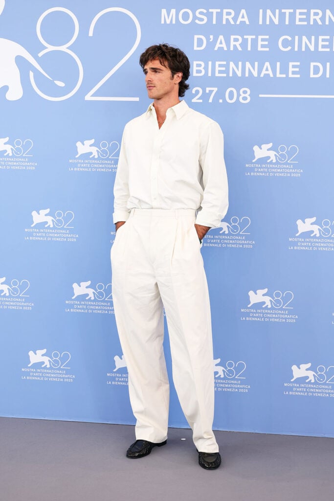 Jacob Elordi arrives at Hotel Excelsior Venice, Venice Film Festival Frankenstein Photocall, Jacob Elordi Venice Film Festival, Jacob Elordi Bottega Veneta, Jacob Elordi Frankenstein, Venice Film Festival 2025 fashion, Jacob Elordi style, white shirt and trousers