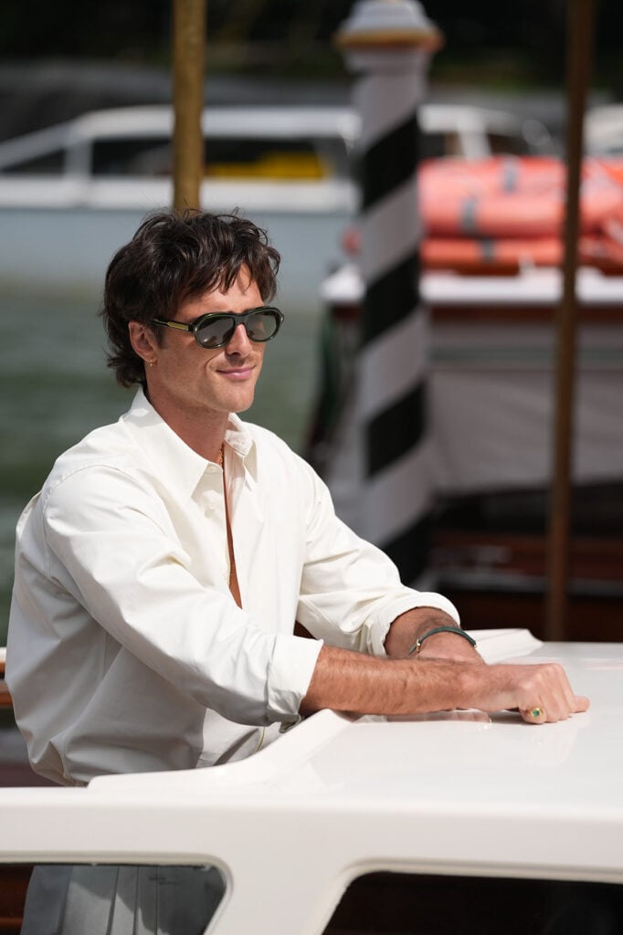 Jacob Elordi arrives at Hotel Excelsior Venice, Venice Film Festival Frankenstein Photocall, Jacob Elordi Venice Film Festival, Jacob Elordi Bottega Veneta, Jacob Elordi Frankenstein, Venice Film Festival 2025 fashion, Jacob Elordi style, white shirt and trousers