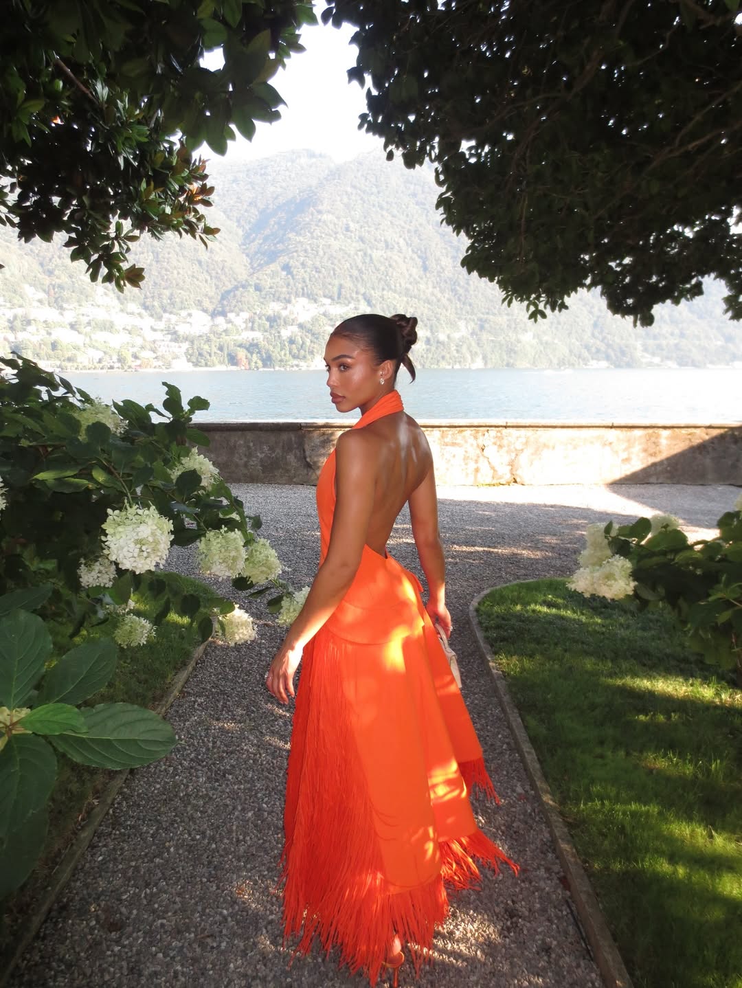Lori Harvey's Vacation Ready Orange Bottega Veneta Fringe Dress