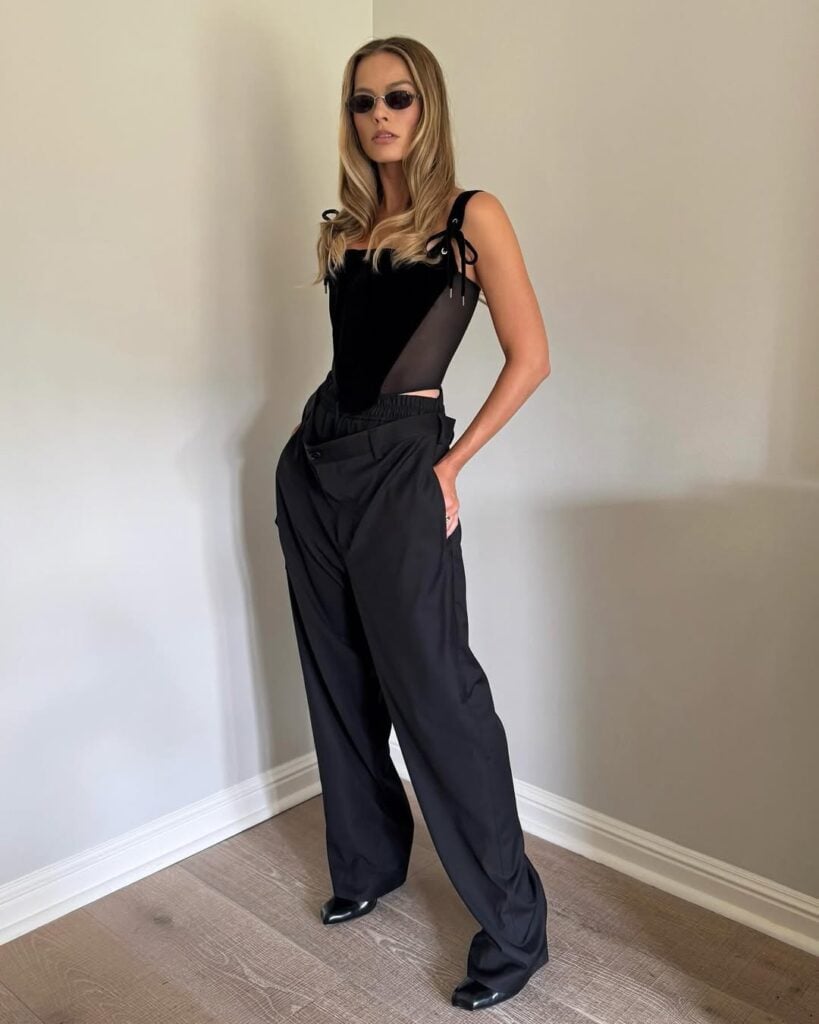 Margot Robbie Wore Vivienne Westwood To The Press Junket For ‘A Big Bold Beautiful Journey’ Margot Robbie style, Margot Robbie Vivienne Westwood, Margot Robbie trousers, A Big Bold Beautiful Journey press tour, Vivienne Westwood fashion