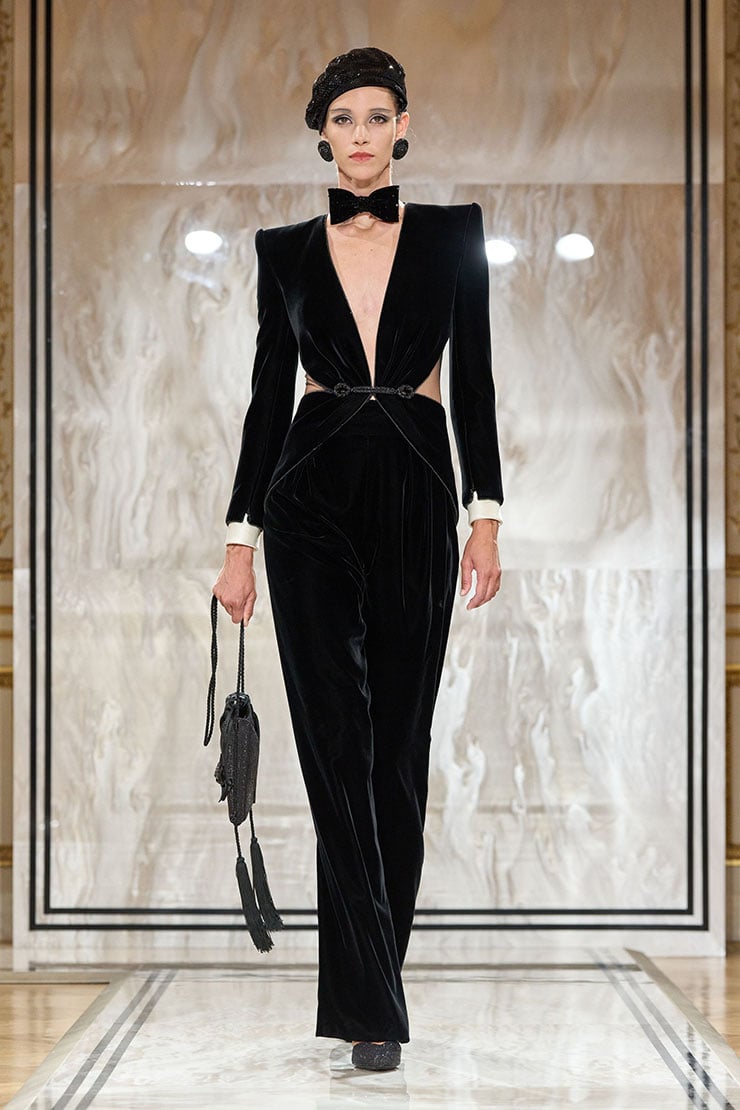 Armani Privé Fall 2025 black velvet jumpsuit with contrasting white draped detail on the runway.