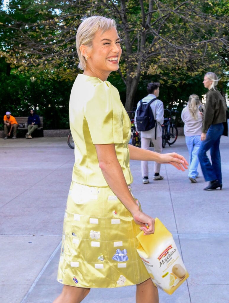 Brie Larson, Sandy Liang Spring 2026, lemon yellow outfit, kitchen couture, Party People press tour, Aquazzura Bow Tie pumps, Moschino Pepperidge Farm cookie bag