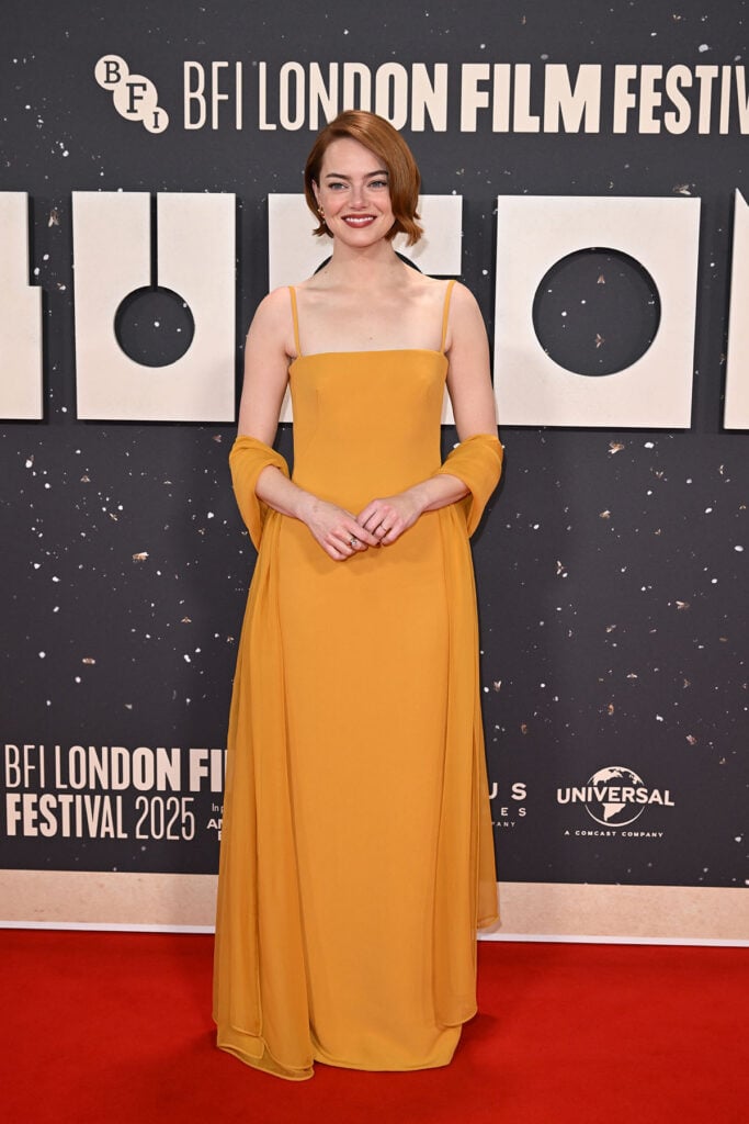 Emma Stone Wore Louis Vuitton To The 'Bugonia' London Film Festival Premiere, Emma Stone, Louis Vuitton, Bugonia premiere, London Film Festival 2025, Emma Stone red carpet, Louis Vuitton custom gown, mustard yellow dress