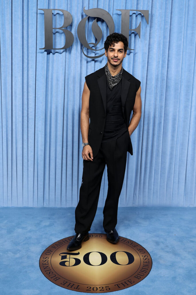 Ishaan Khatter BoF500 Gala, black sleeveless suit, modern menswear, red carpet look, Paris Fashion Week 2025