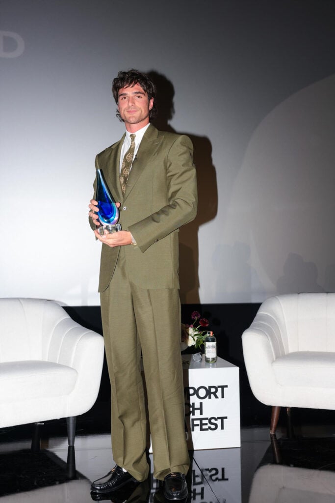 Jacob Elordi, Celine, Newport Beach Film Festival, Frankenstein press tour, olive green suit, paisley tie, Cartier jewellery, Celine Luco Triomphe loafers