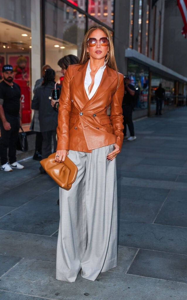 Jennifer Lopez Kiss of a Spider Woman, Jennifer Lopez Ralph Lauren Collection Pre-Fall 2025, Jennifer Lopez Harithand, Jennifer Lopez Willy Chavarria Spring 2026, Jennifer Lopez Christian Dior 2000s, Jennifer Lopez Tyler Ellis Lee Lineage clutch, Jennifer Lopez Andrea Wazen Katy sandals, Jennifer Lopez Chloé sunglasses