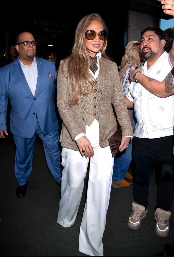 Jennifer Lopez Kiss of a Spider Woman, Jennifer Lopez Ralph Lauren Collection Pre-Fall 2025, Jennifer Lopez Harithand, Jennifer Lopez Willy Chavarria Spring 2026, Jennifer Lopez Christian Dior 2000s, Jennifer Lopez Tyler Ellis Lee Lineage clutch, Jennifer Lopez Andrea Wazen Katy sandals, Jennifer Lopez Chloé sunglasses