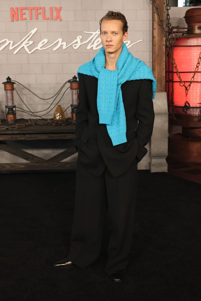 Felix Kammerer attends the Los Angeles premiere of Netflix's "Frankenstein", red carpet menswear 2025