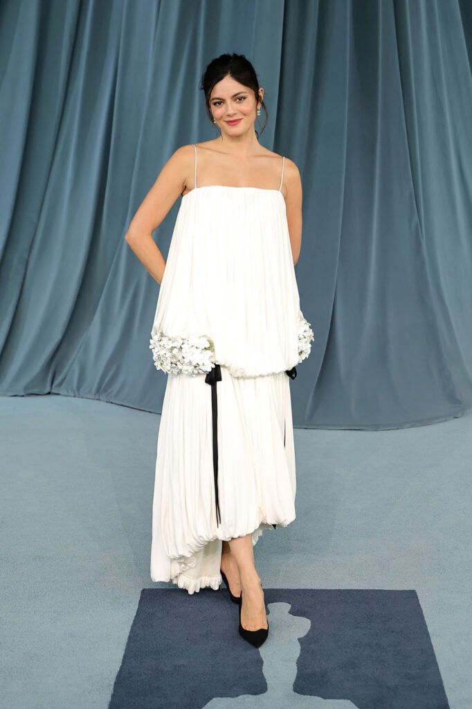 Monica Barbaro attends the Academy Museum 5th Annual Gala, Monica Barbaro Dior, Monica Barbaro Academy Museum Gala 2025, Dior white silk dress, Dior Spring 2026, Jonathan Anderson Dior, Monica Barbaro red carpet, Dior bustier gown