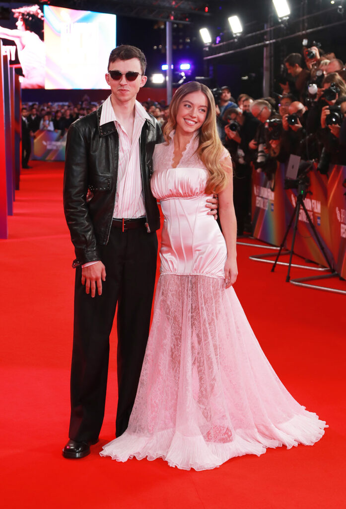 Trent Sweeney (L) and Sydney Sweeney attend the Headline Gala screening of "Christy" during The 69th BFI London Film Festival, Sydney Sweeney, Trent Sweeney, Alexander McQueen, Christy premiere, London Film Festival, The Royal Festival Hall, McQueen Pre-Fall 2025, McQueen custom gown, red carpet fashion