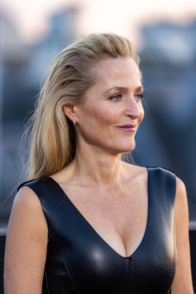 Gillian Anderson Wore Norma Kamali To Disney’s ‘Tron: Ares’ Piccadilly Lights Event, Gillian Anderson Tron Ares, Gillian Anderson Norma Kamali, Tron Ares UK event Piccadilly Lights, Gillian Anderson Disney Tron Ares, Gillian Anderson red carpet 2025, Gillian Anderson leather dress