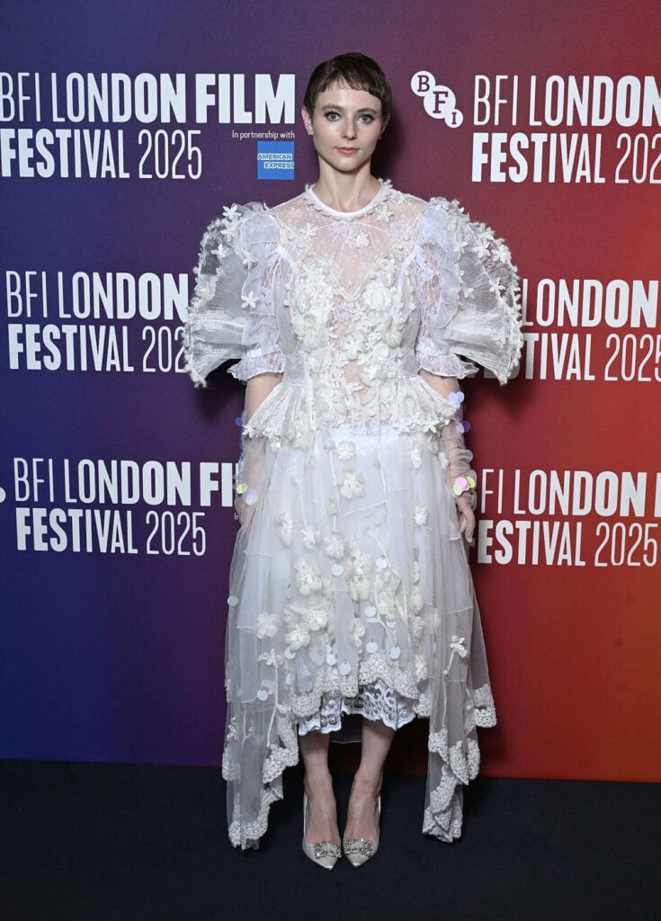 Thomasin McKenzie attends "The Testament Of Ann Lee" Official Screening during the 69th BFI London Film Festival, white Bora Aksu Spring 2026 dress, The Testament of Ann Lee, Amanda Seyfried, Thomasin McKenzie, Stacy Martin, Viola Prettejohn, London Film Festival 2025, Richard Quinn Fall 2025, Bora Aksu Spring 2026, Louis Vuitton, Miu Miu