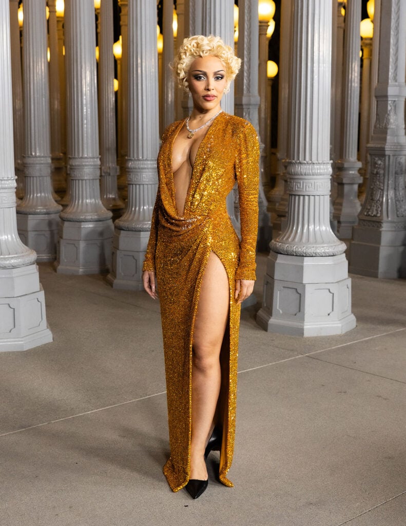 Doja Cat, wearing Gucci, attends the 2025 LACMA Art+Film Gala, Doja Cat Gucci gold dress, Doja Cat LACMA Art+Film Gala red carpet, Doja Cat performance look, Doja Cat gold sequin gown