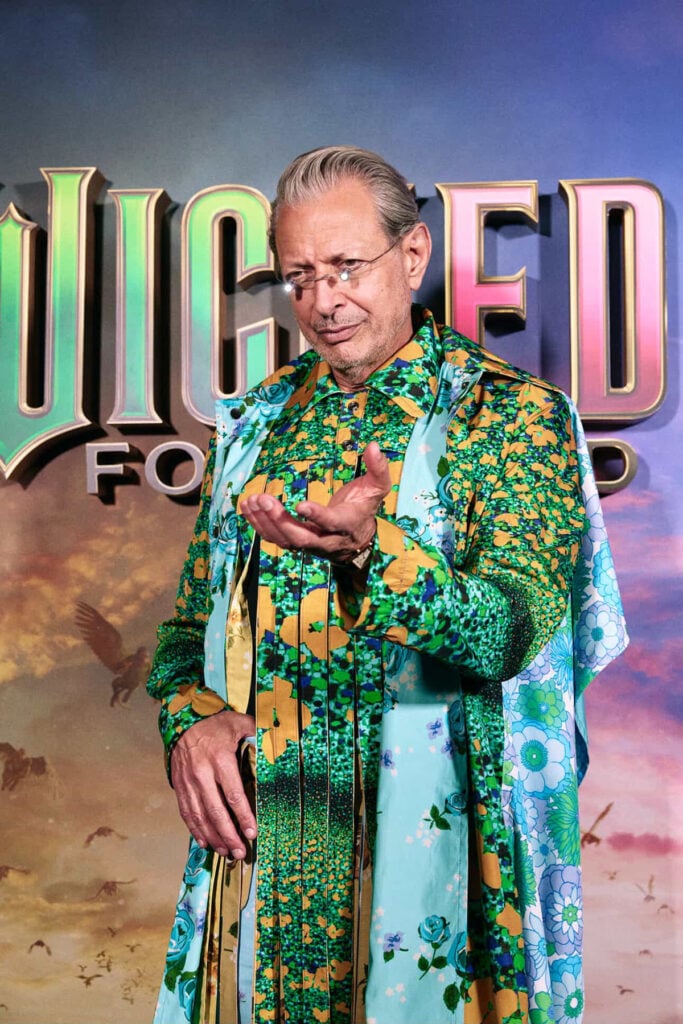 Jeff Goldblum Wicked For Good press tour, Wicked For Good Singapore photocall, Craig Green Spring 2026, Dior Men Spring 2026, Jeff Goldblum Craig Green floral print, Dior cape menswear, Wicked For Good Singapore premiere red carpet