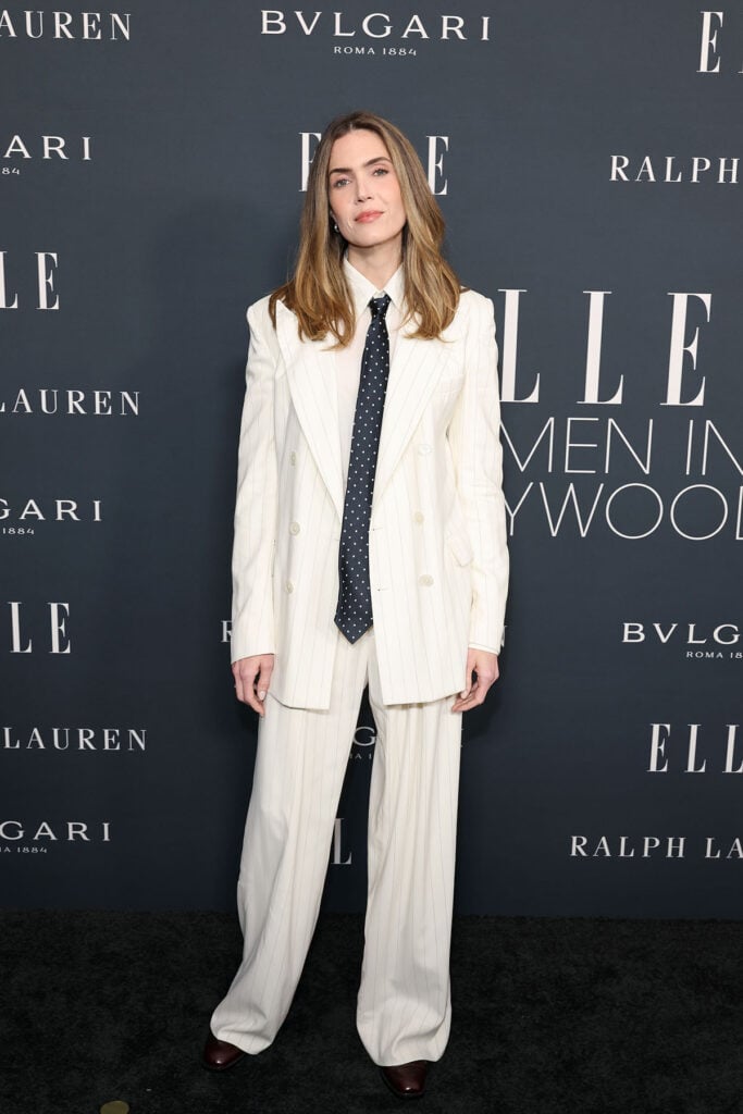 Mandy Moore, wearing Ralph Lauren, attends ELLE's 2025 Women in Hollywood Celebration, Mandy Moore, Mandy Moore Ralph Lauren, Ralph Lauren striped suit, cream pinstripe suit, menswear-inspired womenswear, Mandy Moore red carpet 2025, Elle Women in Hollywood 2025