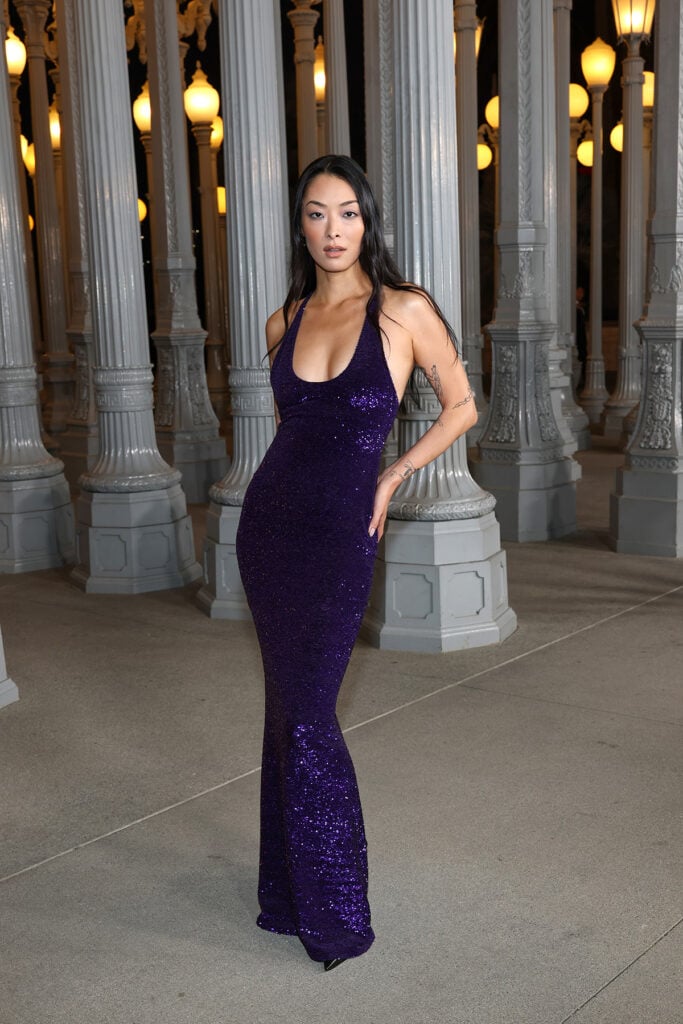 Rina Sawayama, wearing Gucci, attends the 2025 LACMA Art+Film Gala, Rina Sawayama Gucci purple dress, Rina Sawayama LACMA Art+Film Gala red carpet, Rina Sawayama sequin halterneck gown, Rina Sawayama Gucci look