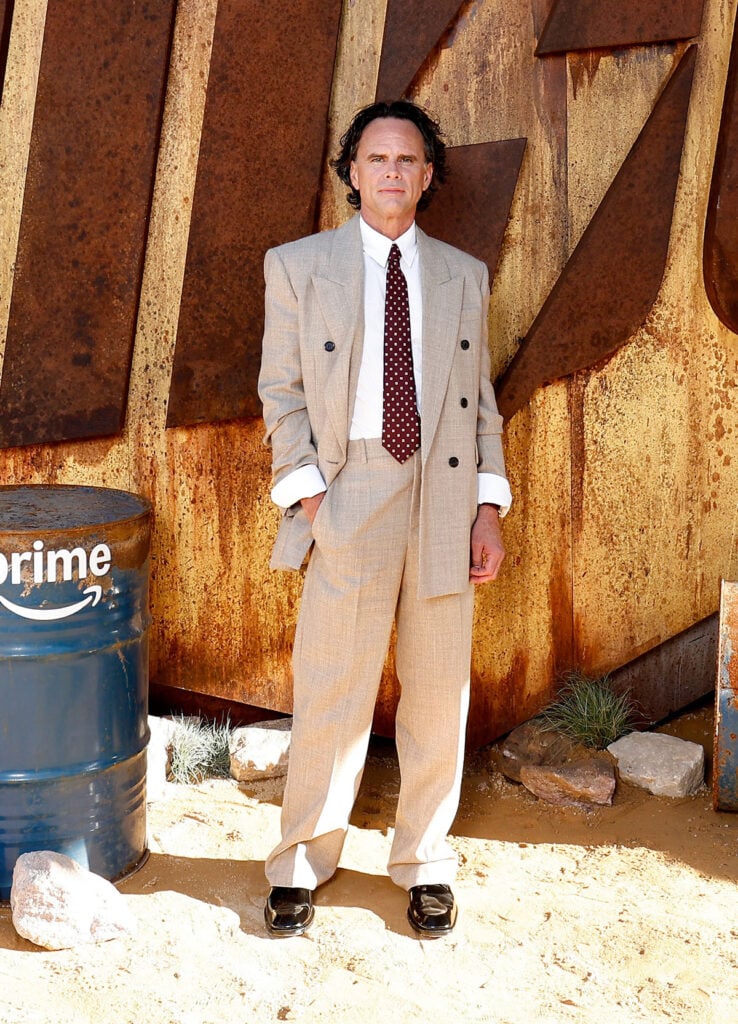Walton Goggins at the Fallout Season 2 Special Screening, wearing a beige Saint Laurent suit.