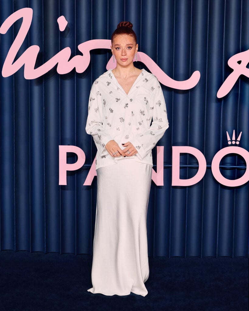 Erin Kellyman Miu Miu look, Erin Kellyman The Fashion Awards 2025 red carpet, Miu Miu embroidered blouse, Miu Miu white silk skirt, Erin Kellyman style