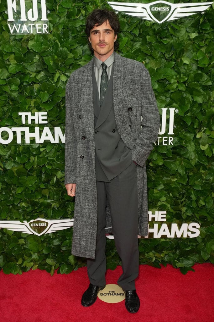 Gotham Film Awards menswear, Gotham Film Awards red carpet, Jacob Elordi style, Giorgio Armani Made to Measure, grey tweed overcoat, double-breasted shawl collar suit, menswear tailoring, textured grey suit, red carpet menswear 2025
