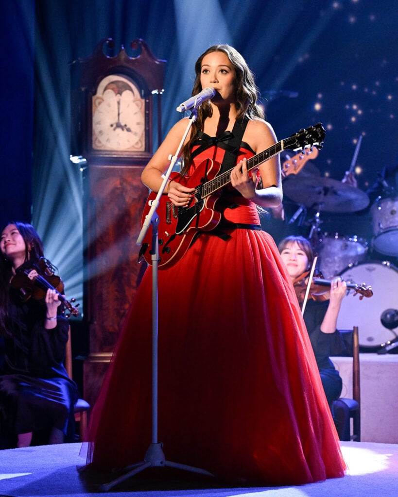 Laufey, Laufey red dress, Richard Quinn Spring 2025, The Tonight Show, Lover Girl performance, A Matter of Time, Grammy nominee, red tulle gown, strapless gown, Dove Cameron Richard Quinn, BoF 500, fashion news, celebrity style, TV performance fashion