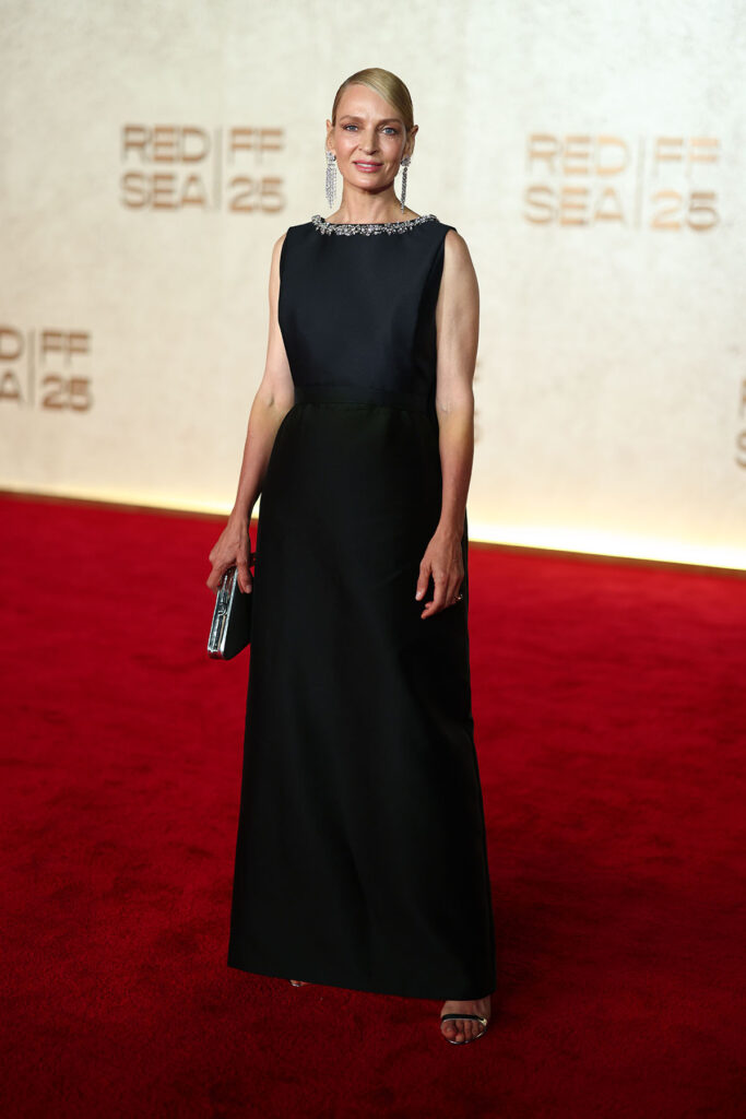 Uma Thurman attends the opening night red carpet for "Giant" at the Red Sea International Film Festival 2025. Uma Thurman, Prada black embellished gown, silver leather Prada sandals, Chopard jewellery, Giant premiere Red Sea Film Festival, Uma Thurman red carpet Prada, 2025 Red Sea International Film Festival red carpet