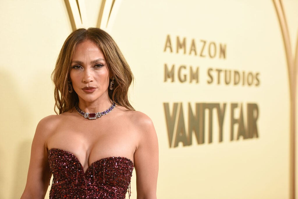 Jennifer Lopez Wore Zuhair Murad To The Vanity Fair And Amazon MGM Studios Celebrate Awards Season 2026 Party, Jennifer Lopez, Vanity Fair awards season, Amazon MGM Studios event, Jennifer Lopez red carpet, Zuhair Murad Fall 2025 Couture, burgundy strapless gown, beaded fringe dress, sheer tulle skirt, celebrity fashion 2026