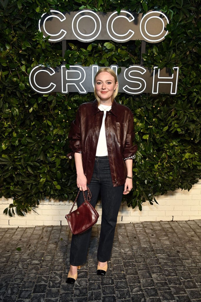 Dakota Fanning, wearing CHANEL, attends a CHANEL Dinner to Celebrate Coco Crush 