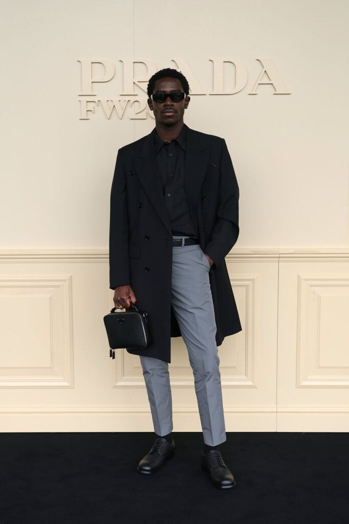Kevin Costner, Jack O’Connell, Tom Blyth, Hudson Williams, Damson Idris, Nicholas Hoult, Louis Partridge, Rauw Alejandro, James Norton, Milan Fashion Week menswear, Paris Fashion Week menswear, menswear front row celebrities, fashion week menswear style, Brioni menswear, Armani menswear, Prada menswear, Tod’s menswear