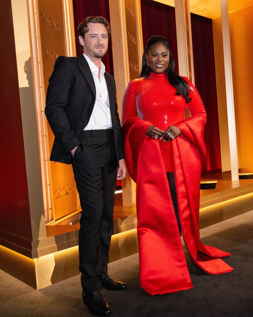 Danielle Brooks Wore Sergio Hudson For The Academy Awards Nominations Announcement, Lewis Pullman, Danielle Brooks, 2026 Oscars nominations announcement, Oscars nominees announcement Beverly Hills, Samuel Goldwyn Theater, Danielle Brooks red dress, Sergio Hudson Resort 2026, Messika jewelry, Lewis Pullman style, Oscars nominations presenters, Academy Awards nominations announcement