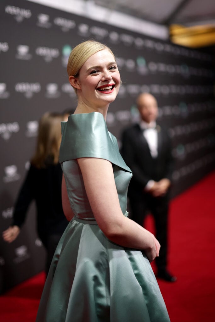 Elle Fanning Wore Vintage Nettie Rosenstein To The 2025  Palm Springs International Film Awards, Elle Fanning, Palm Springs International Film Festival Film Awards red carpet, vintage Nettie Rosenstein dress, 1950s fashion, Sentimental Value cast, Xtabay vintage, Elle Fanning red carpet, classic Hollywood style,