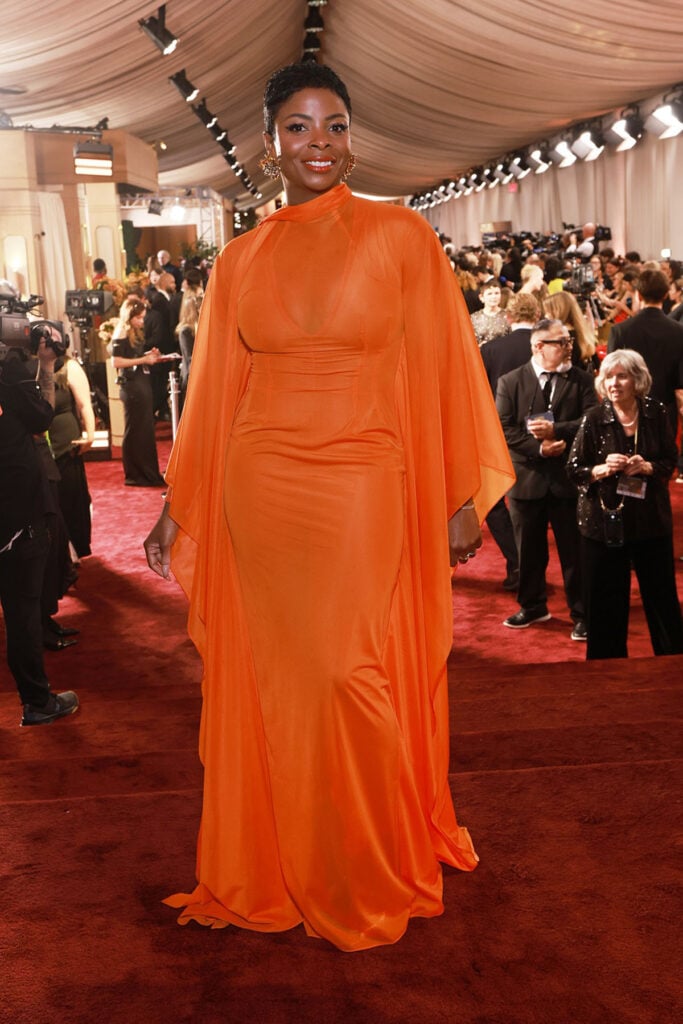Janelle James, 2026 Golden Globe Awards, LaQuan Smith dress, orange evening gown, Golden Globes red carpet, celebrity red carpet fashion