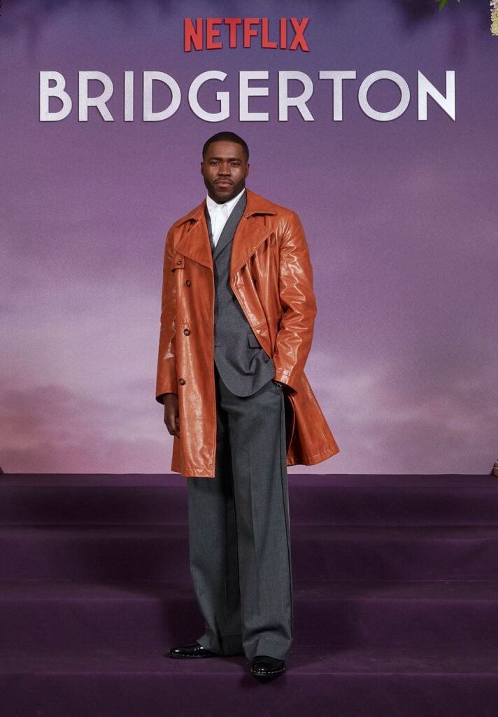 Martins Imhangbe Bridgerton Season 4 Paris premiere, Martins Imhangbe red carpet style, Bridgerton Paris premiere menswear, leather coat red carpet men, MM6 Maison Margiela menswear