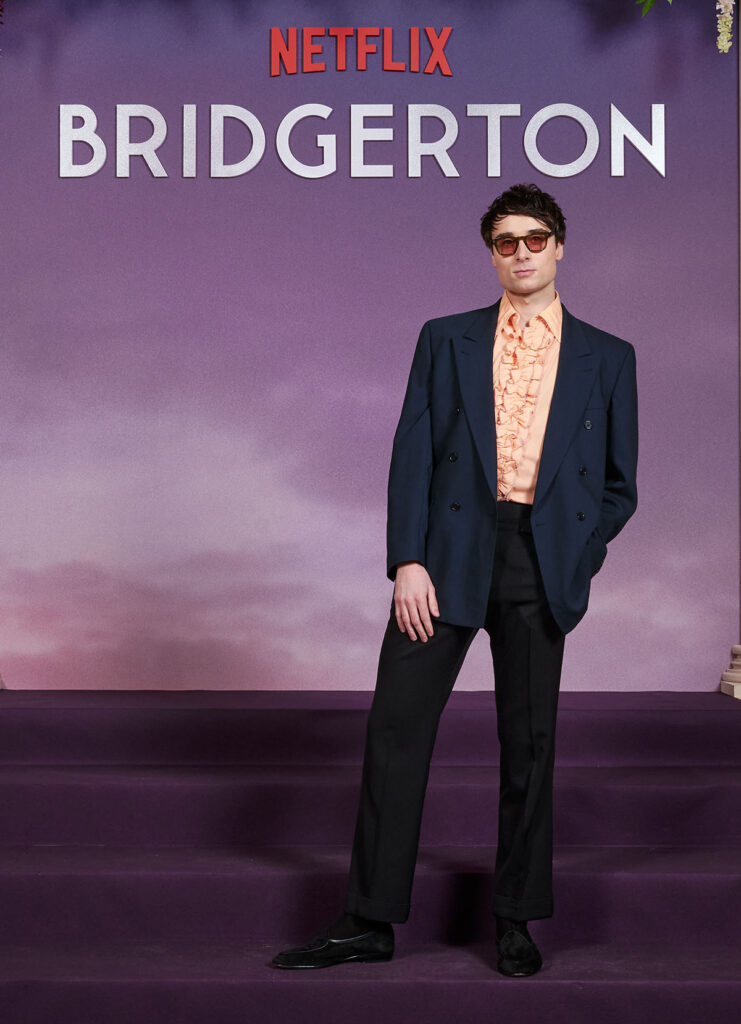 Oli Higginson Bridgerton Season 4 Paris premiere, Oli Higginson red carpet style, Bridgerton Paris premiere menswear, vintage Dior jacket red carpet, 1970s inspired menswear red carpet