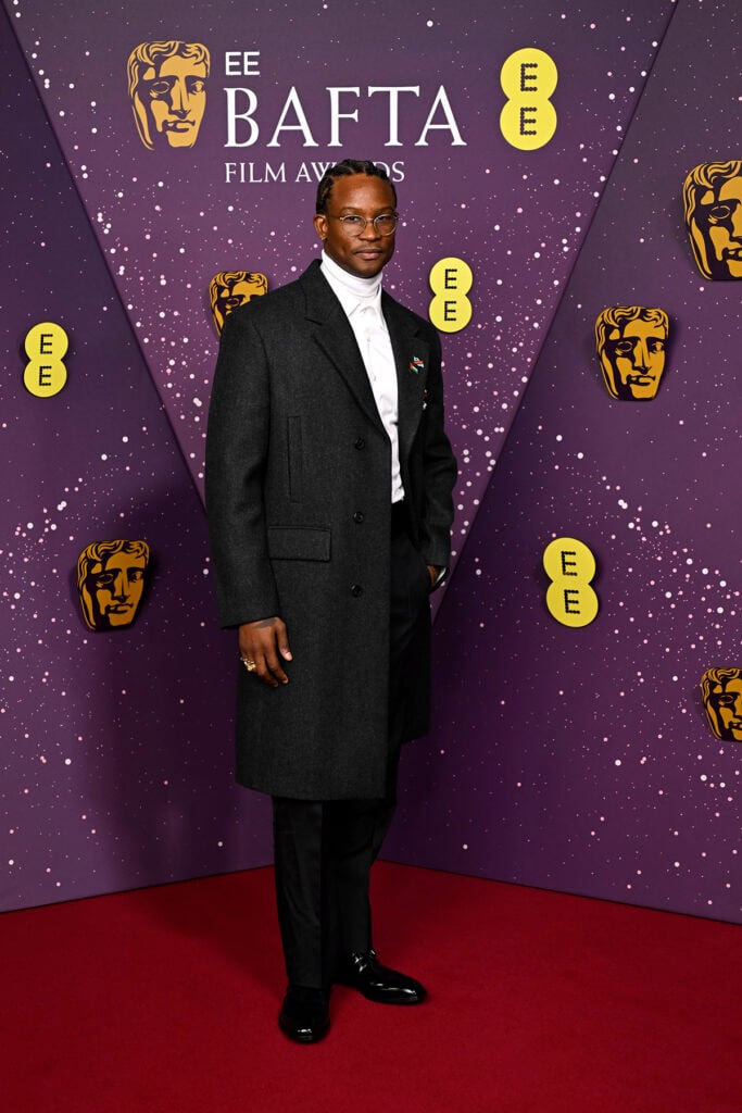 Akinola Davies Jr. attends the EE BAFTA Film Awards 2026, Prada, 2026 BAFTA Film Awards, BAFTAs red carpet, Kate Hudson, Kerry Washington, Carey Mulligan, Michael B. Jordan, Paul Mescal, Sadie Sink, Akinola Davies Jr., Prada gown, Prada tuxedo, custom Prada, celebrity fashion, red carpet style