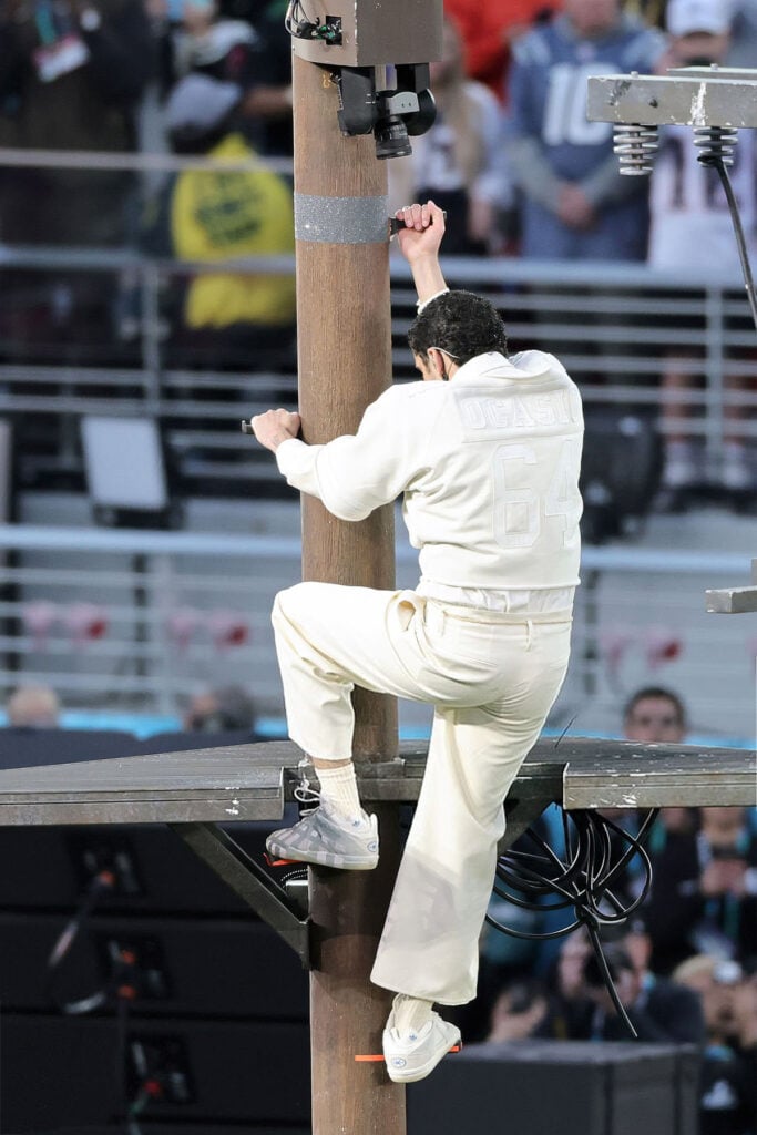 Bad Bunny performs onstage during the Apple Music Super Bowl LX Halftime Show, Bad Bunny Super Bowl LX, Bad Bunny halftime show 2026, Bad Bunny Zara Super Bowl, Bad Bunny Super Bowl outfit, Puerto Rican symbolism Super Bowl, Bad Bunny 64 jersey, Bad Bunny Ocasio jersey, Super Bowl LX halftime fashion