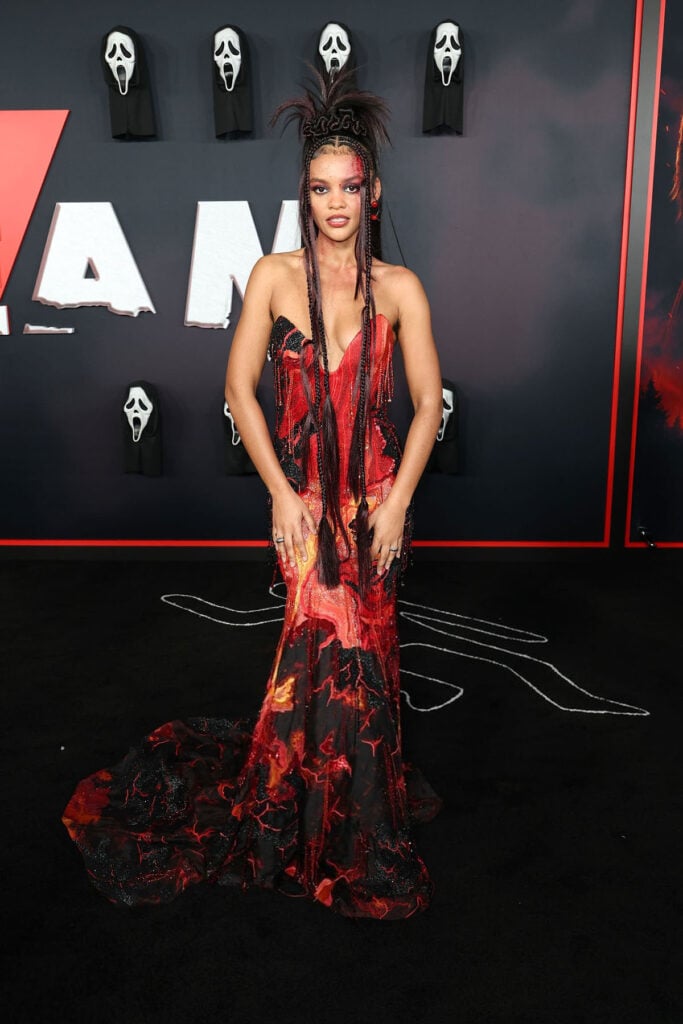 Celeste O'Connor Wore Rahul Mishra Couture To The 'Scream 7' LA Premiere, Celeste O'Connor, Rahul Mishra Spring 2026 Couture, Rahul Mishra Couture, Scream 7 LA premiere, Scream 7 red carpet, horror themed fashion, blood splatter makeup, Spring 2026 Couture runway, Los Angeles premiere fashion, celebrity premiere style