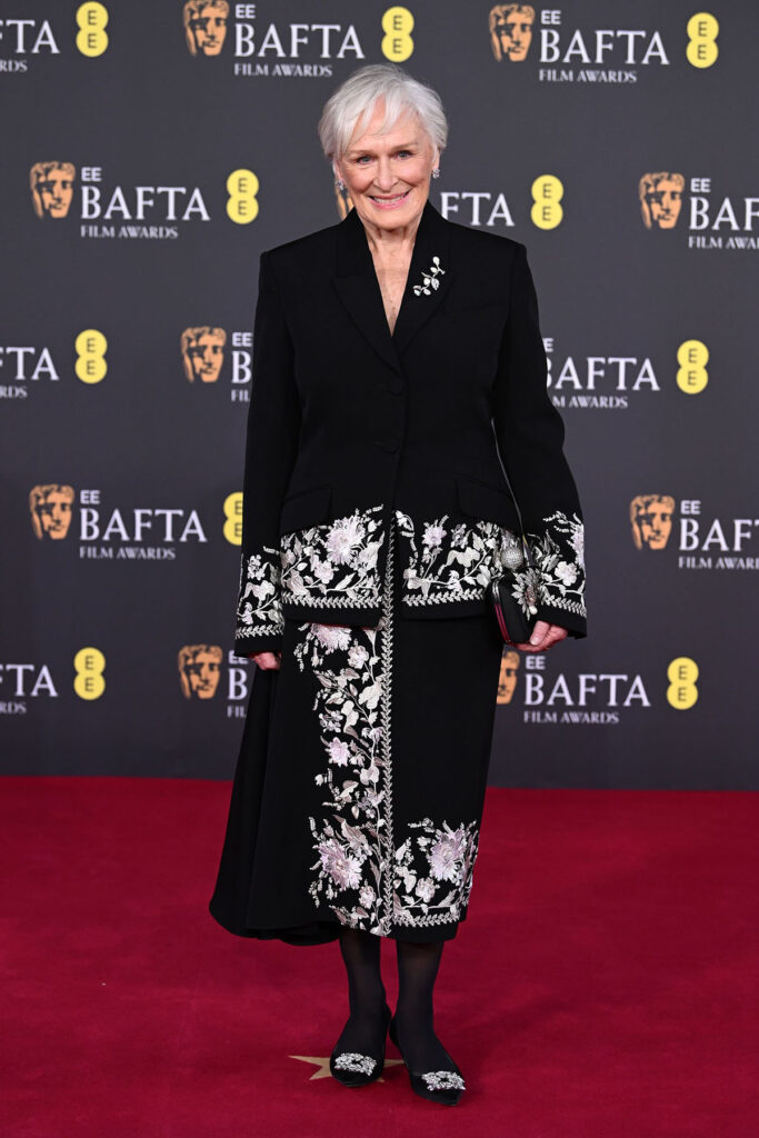 Glenn Close, Erdem Resort 2026 suit, Glenn Close BAFTAs 2026, Erdem embroidered suit, floral embellished tailoring, Roger Vivier clutch and shoes, Anabela Chan jewellery