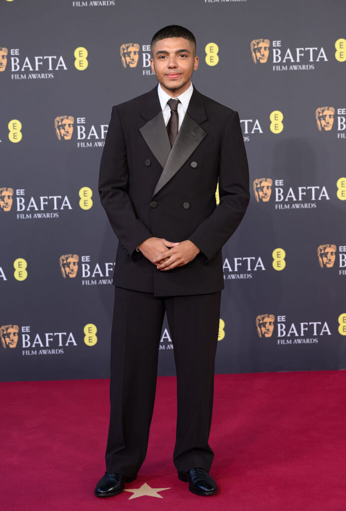 Jay Lycurgo, Jay Lycurgo BAFTAs 2026, BAFTAs menswear, Giorgio Armani tuxedo, brown suit revival, Jimmy Choo Finnion shoes