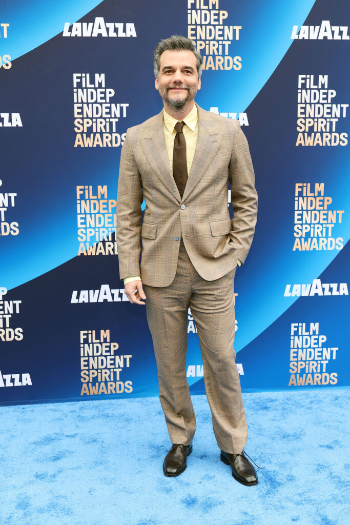 Wagner Moura, Louis Vuitton Prince of Wales suit, Louis Vuitton menswear 2026, beige check suit, yellow shirt styling, Film Independent Spirit Awards 2026, luxury mens tailoring