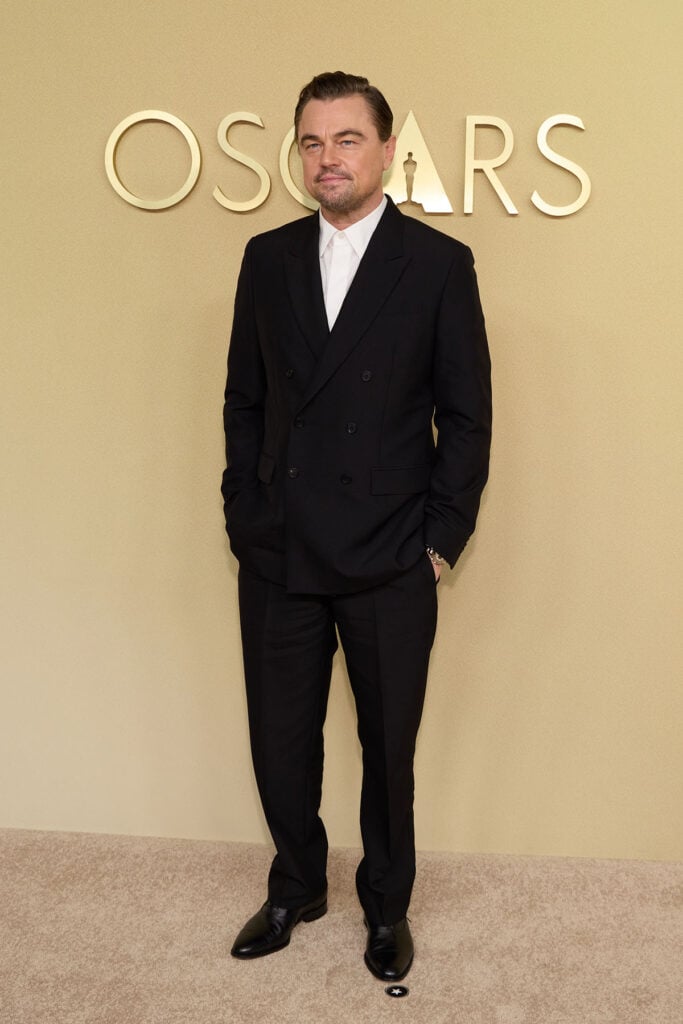 Leonardo DiCaprio, Dior Men, Leonardo DiCaprio Oscars, Oscar Nominees Luncheon 2026, Dior tailoring, tieless suit, Leonardo DiCaprio style evolution, classic black suit