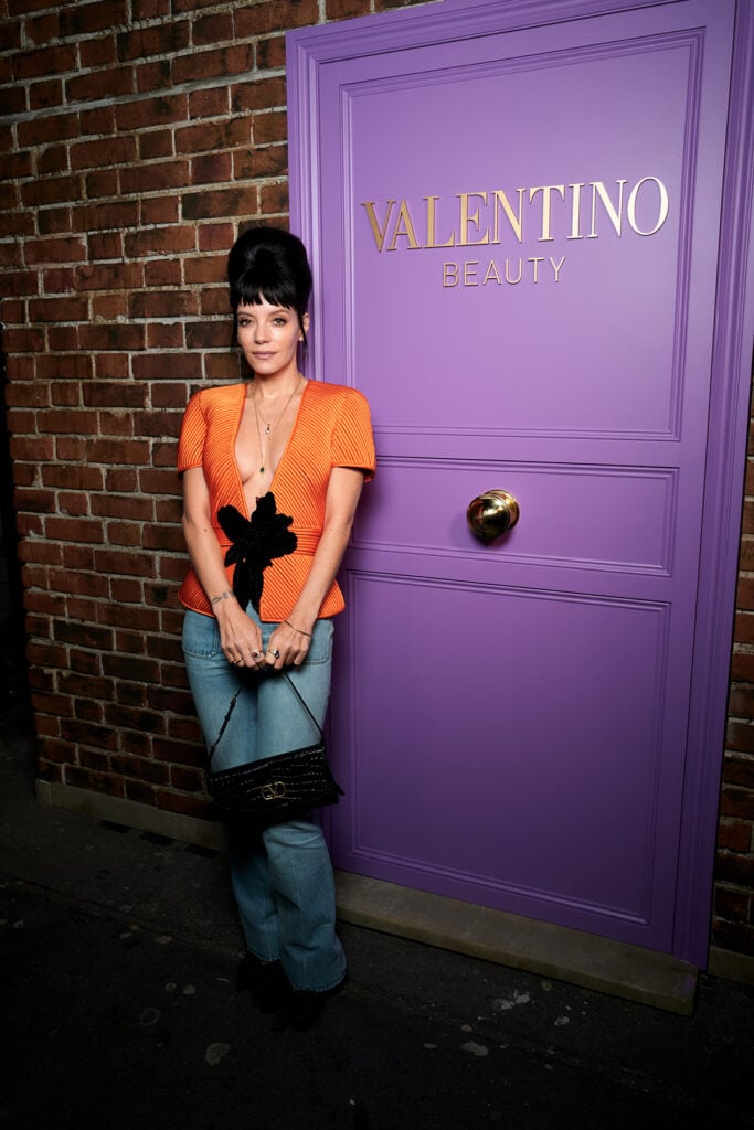 Lily Allen attends the Valentino Beauty x Colman Domingo House party, Colman Domingo, Lily Allen, Valentino Beauty House Party London, Valentino London event, Alessandro Michele Valentino, Colman Domingo Valentino custom look, Lily Allen Valentino Spring 2026 Fireflies collection, Valentino Garavani boots, Valentino Garavani DeVain bag, Boucheron jewellery, London fashion event