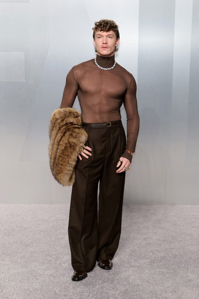 Hudson Williams Vanity Fair Oscar Party 2026, Hudson Williams sheer top Saint Laurent, Vanity Fair Oscar Party 2026 red carpet Hudson Williams, Saint Laurent Vanity Fair Oscar Party Hudson Williams, Hudson Williams Oscars after party look, Connor Storrie Vanity Fair Oscar Party 2026, Connor Storrie sheer brown top Saint Laurent, Vanity Fair Oscar Party 2026 red carpet Connor Storrie, Saint Laurent Vanity Fair Oscar Party Connor Storrie, Connor Storrie Tiffany & Co jewellery Oscars party, Connor Storrie brown sheer look Oscars after party